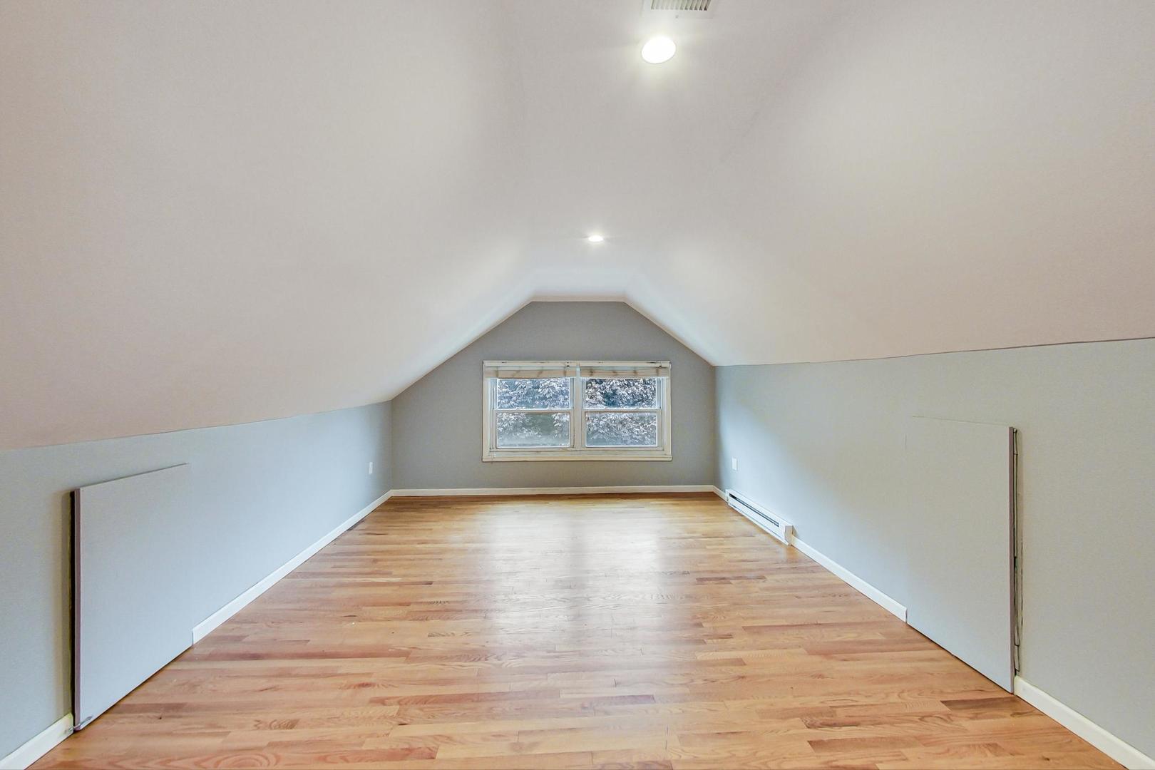 6522 28th Street Berwyn, IL 60402 - Photo 20 of 45 a view of an empty room with wooden floor and a window