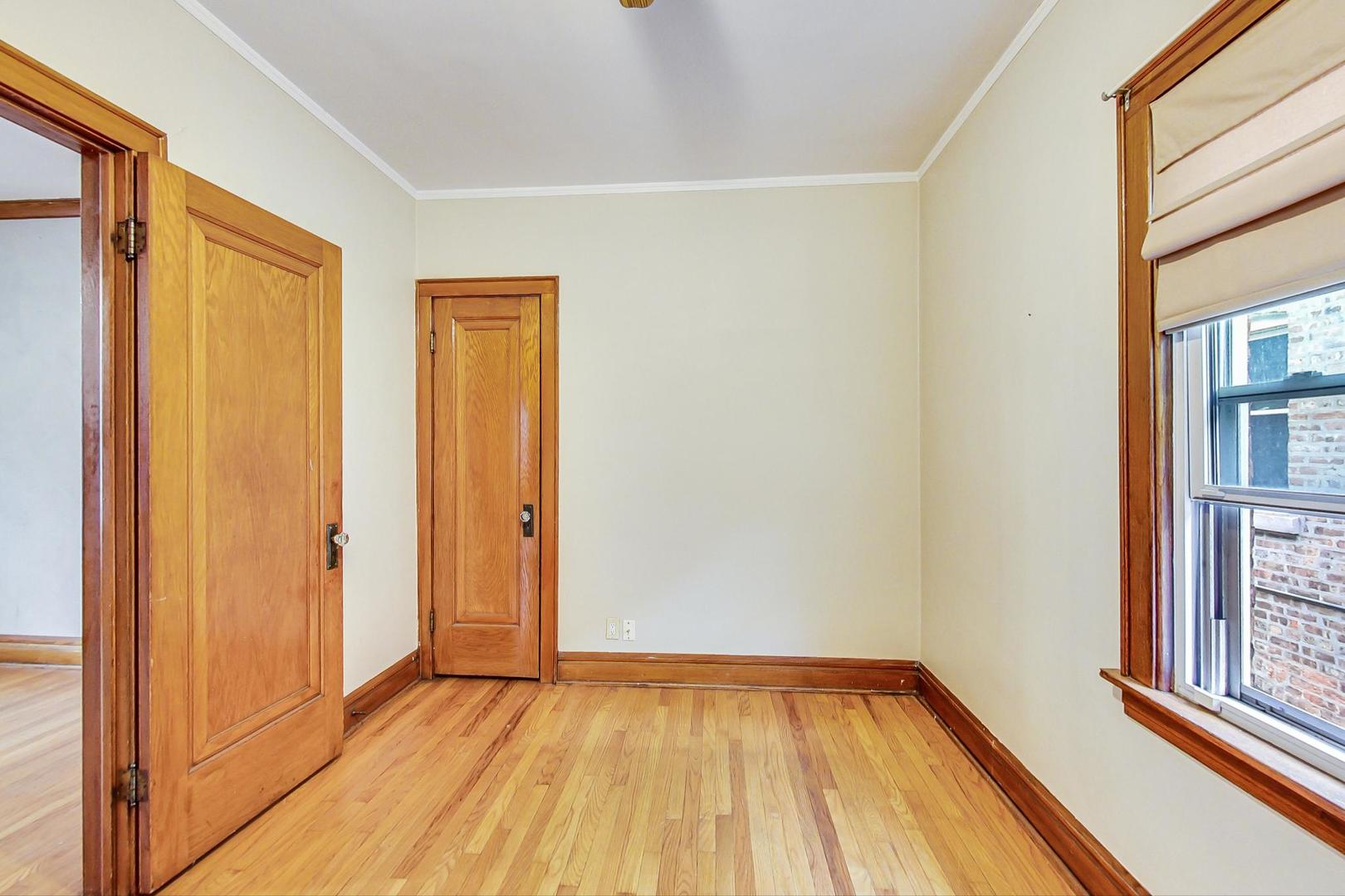 6522 28th Street Berwyn, IL 60402 - Photo 23 of 45 a view of a room with wooden floor and a window