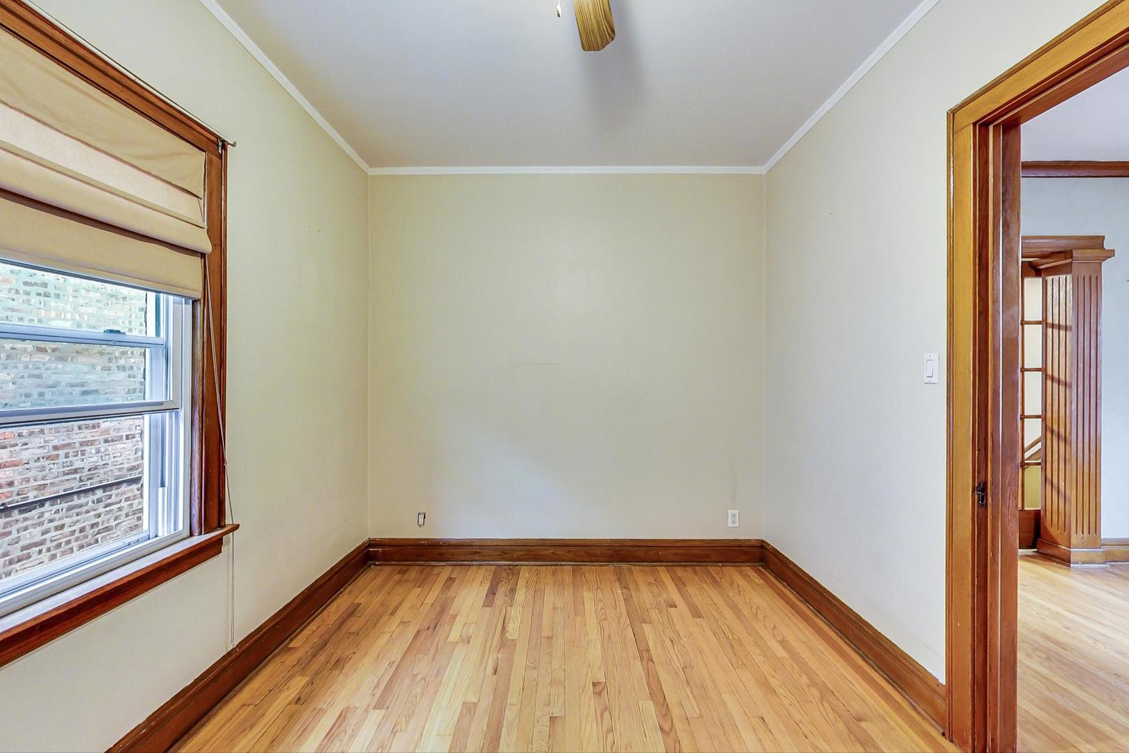 6522 28th Street Berwyn, IL 60402 - Photo 24 of 45 a view of a room with wooden floor and window