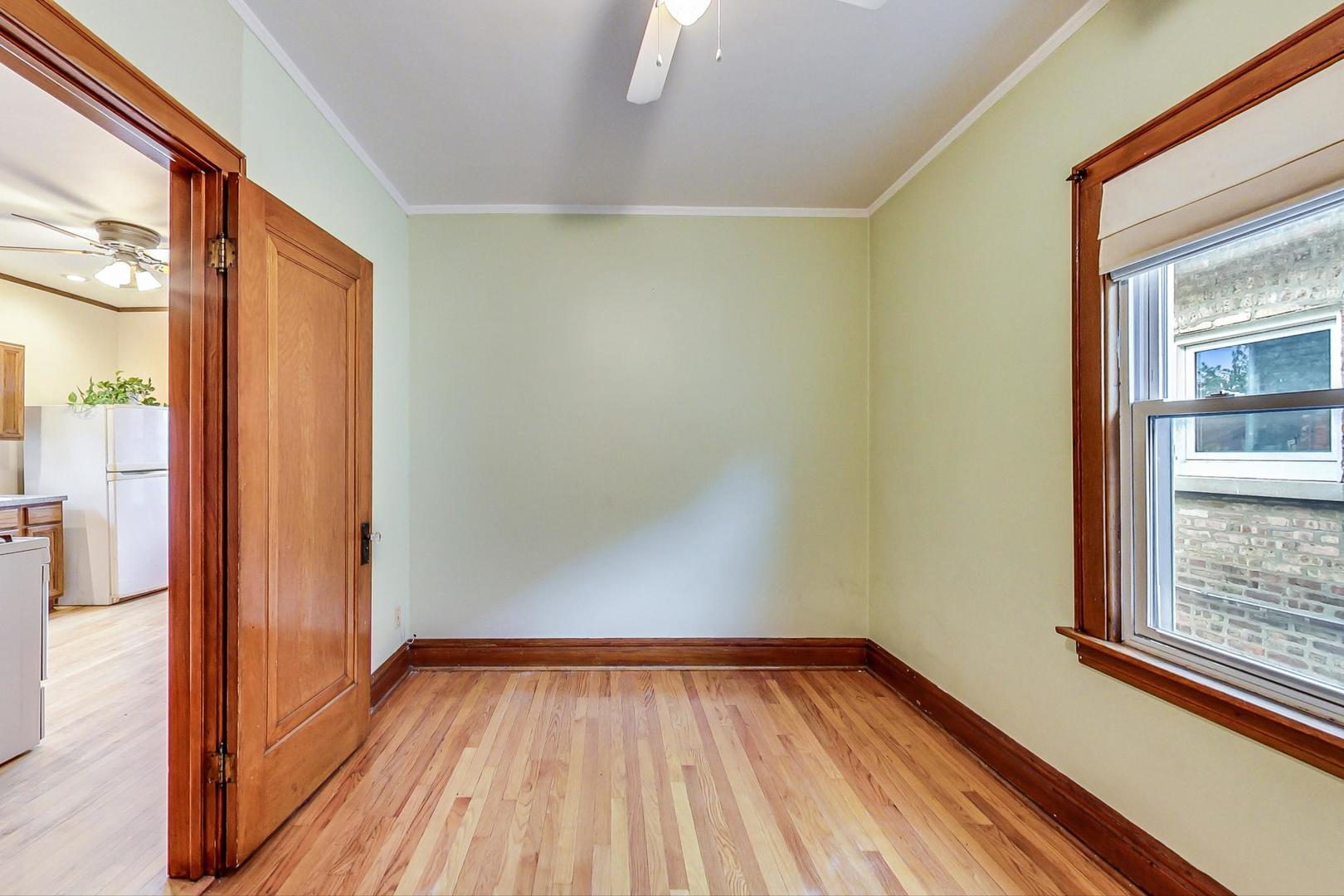 6522 28th Street Berwyn, IL 60402 - Photo 26 of 45 a view of a room with wooden floor and a window