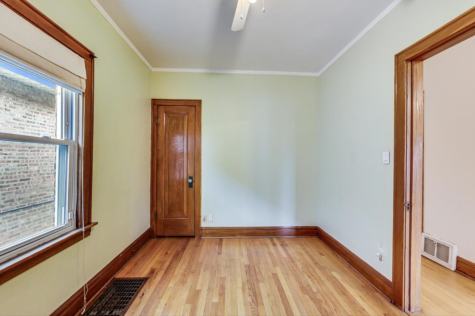 6522 28th Street Berwyn, IL 60402 - Photo 27 of 45 a view of a room with wooden floor and doors