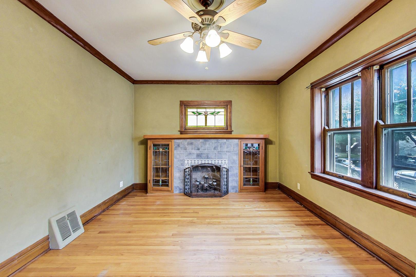 6522 28th Street Berwyn, IL 60402 - Photo 4 of 45 a view of an empty room with a fireplace and a window