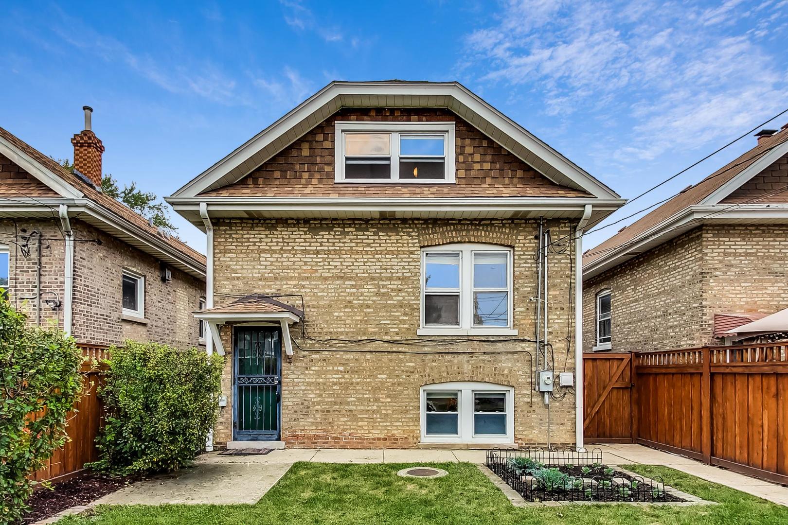 6522 28th Street Berwyn, IL 60402 - Photo 37 of 45 a front view of a house with a yard