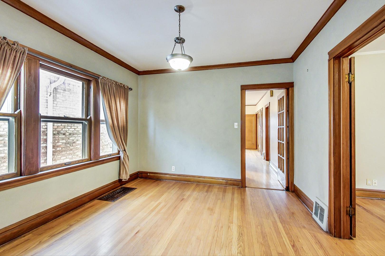 6522 28th Street Berwyn, IL 60402 - Photo 7 of 45 a view of empty room with wooden floor and fan