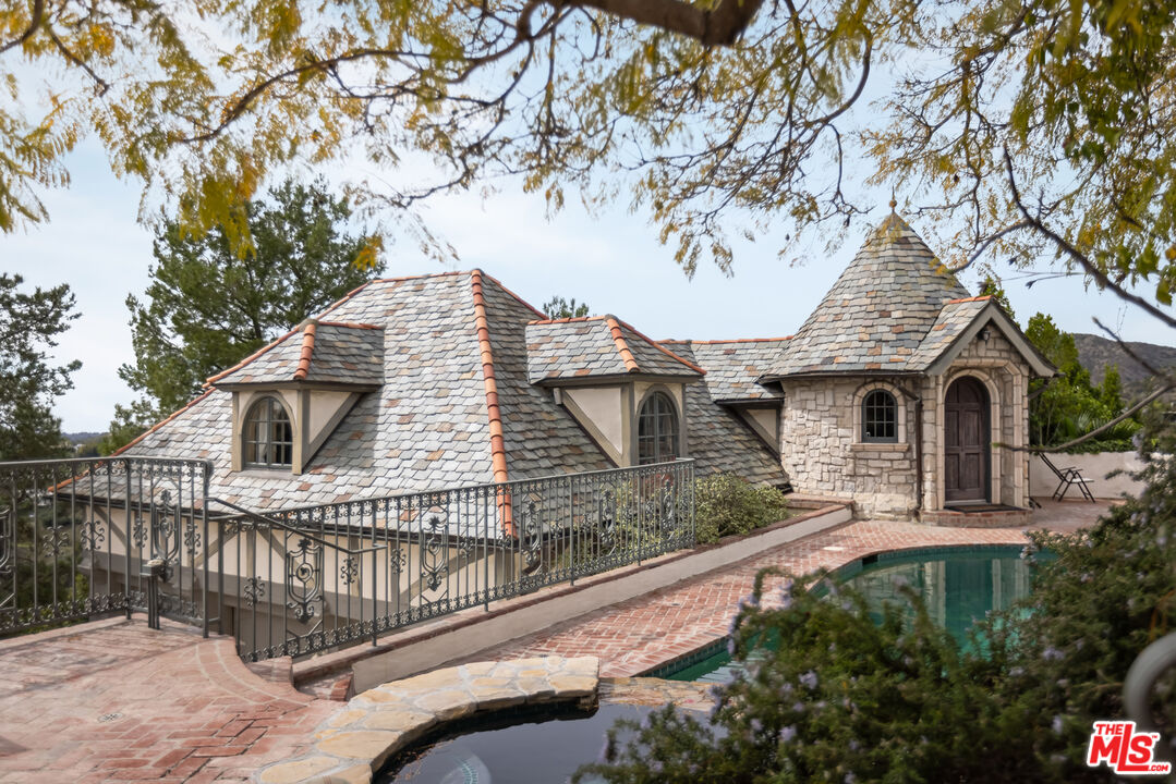 1041 Somera Road Los Angeles, CA 90077 - Photo 13 of 40 a front view of a house with parking space