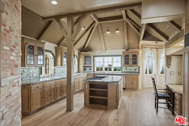 a view of a dining room with furniture and window