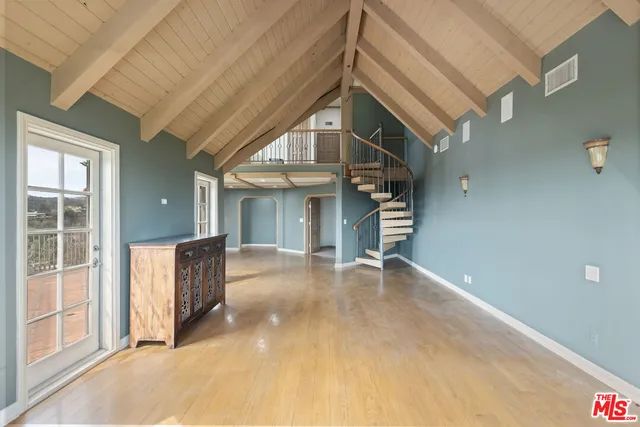 a view of a room with a large window