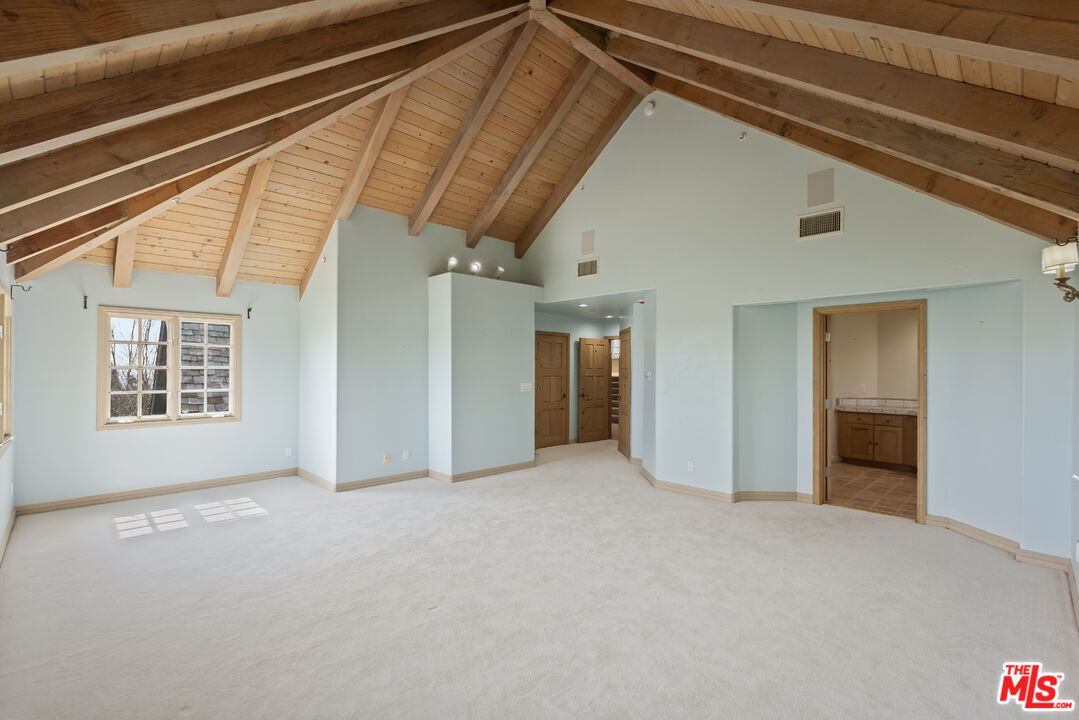 1041 Somera Road Los Angeles, CA 90077 - Photo 22 of 40 a view of an empty room with a window