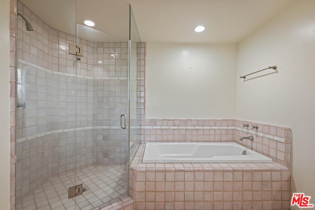 1041 Somera Road Los Angeles, CA 90077 - Photo 23 of 40 a bathroom with a bathtub and shower