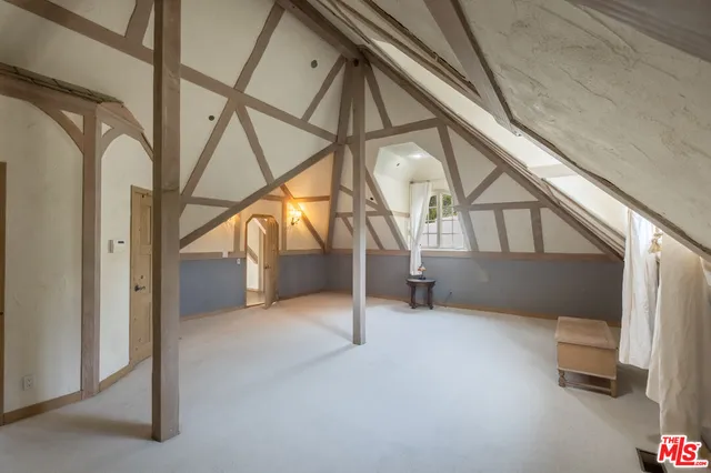an aerial view of residential building and trees around