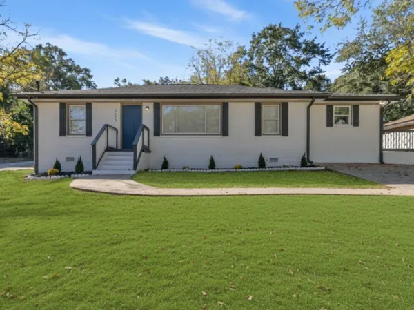a front view of a house with a yard