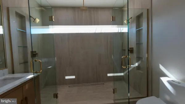 a bathroom with a shower and a toilet