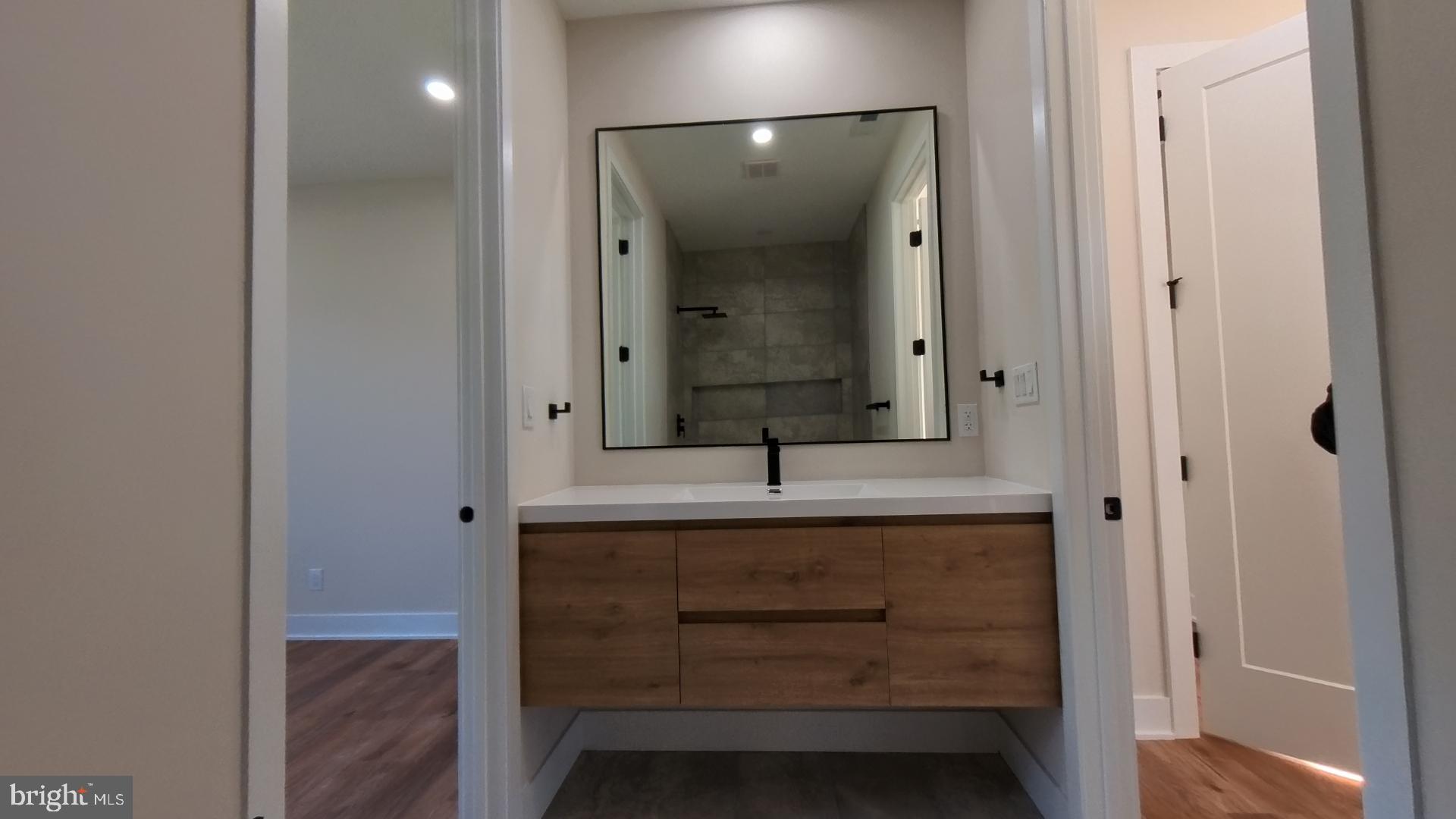 106 Maron Road Hatfield, PA 19440 - Photo 33 of 37 Sleek modern bathroom with natural tones.