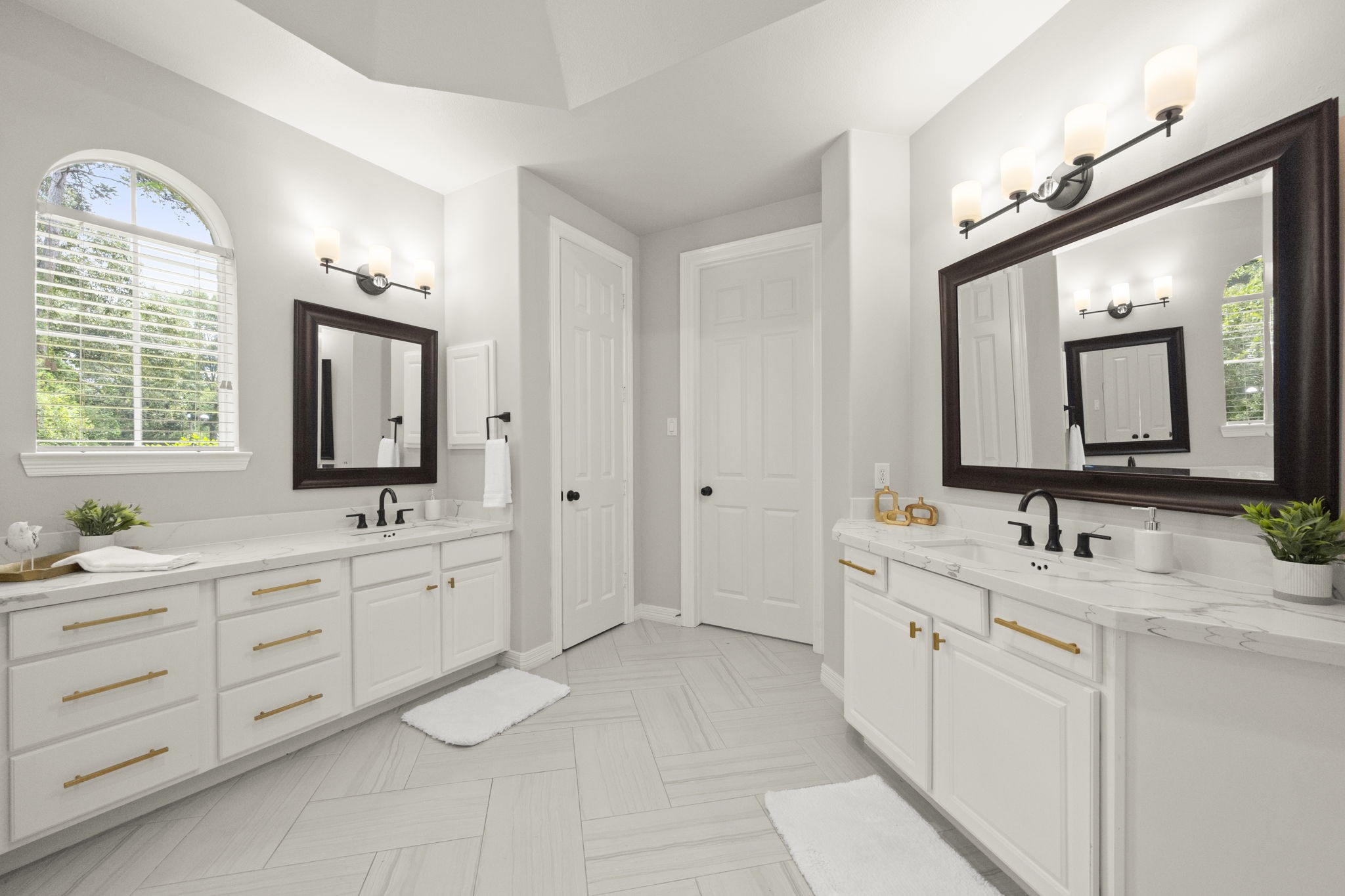 2326 Timbergreen Circle Magnolia, TX 77355 - Photo 20 of 43 a spacious bathroom with a double vanity sink double mirror and a window