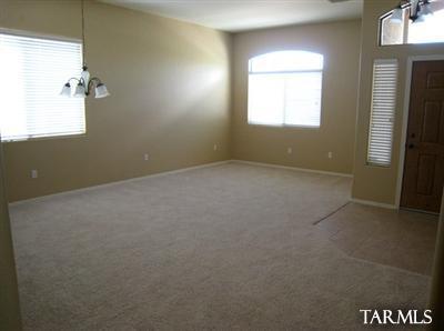 15042 North Pelham Road Tucson, AZ 85739 - Photo 2 of 10 a view of an empty room with a window