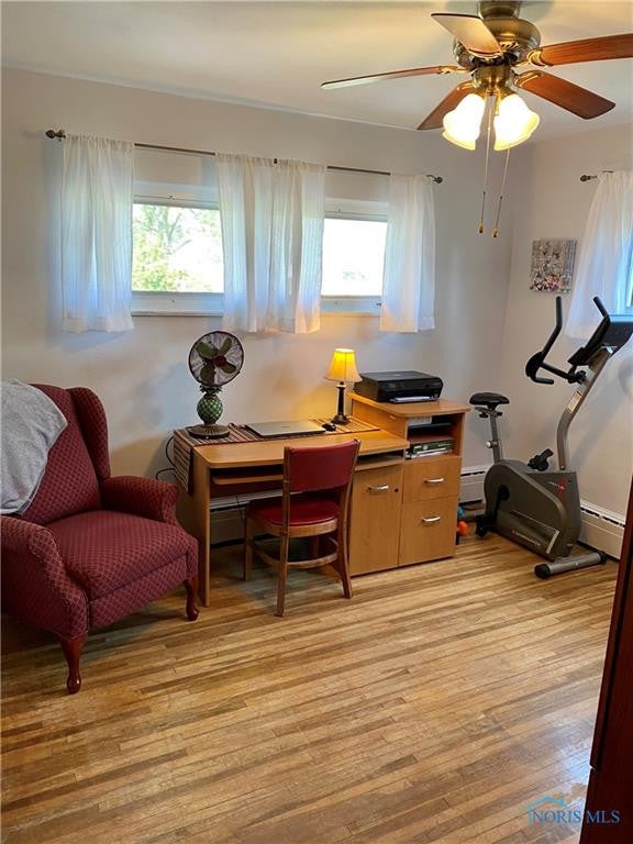 3929 Seaman Road Oregon, OH 43616 - Photo 29 of 50 3rd Bedroom w/ hardwood & ceiling fan.