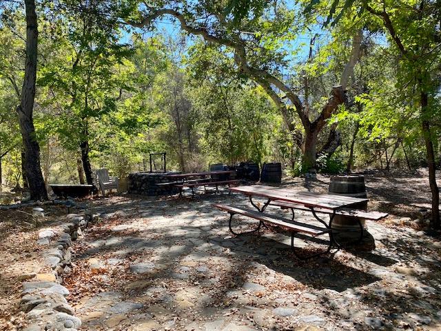 47575 Arroyo Seco Road, Unit 53 Greenfield, CA 93927 - Photo 13 of 21 a backyard of a house with barbeque oven table and chairs