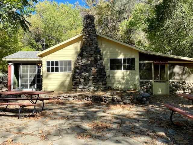 47575 Arroyo Seco Road, Unit 53 Greenfield, CA 93927 - Photo 18 of 21 a backyard of a house with yard and outdoor seating