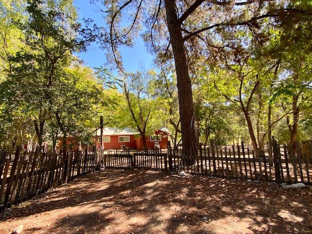 47575 Arroyo Seco Road, Unit 53 Greenfield, CA 93927 - Photo 20 of 21 a view of a yard with wooden fence