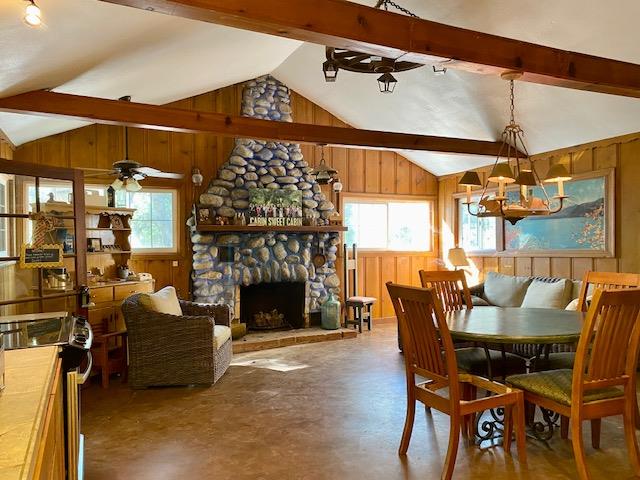 47575 Arroyo Seco Road, Unit 53 Greenfield, CA 93927 - Photo 3 of 21 a living room with furniture a fireplace and a table