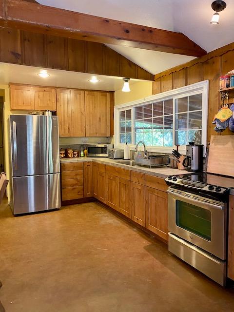 47575 Arroyo Seco Road, Unit 53 Greenfield, CA 93927 - Photo 6 of 21 a kitchen with stainless steel appliances a stove a refrigerator and a sink