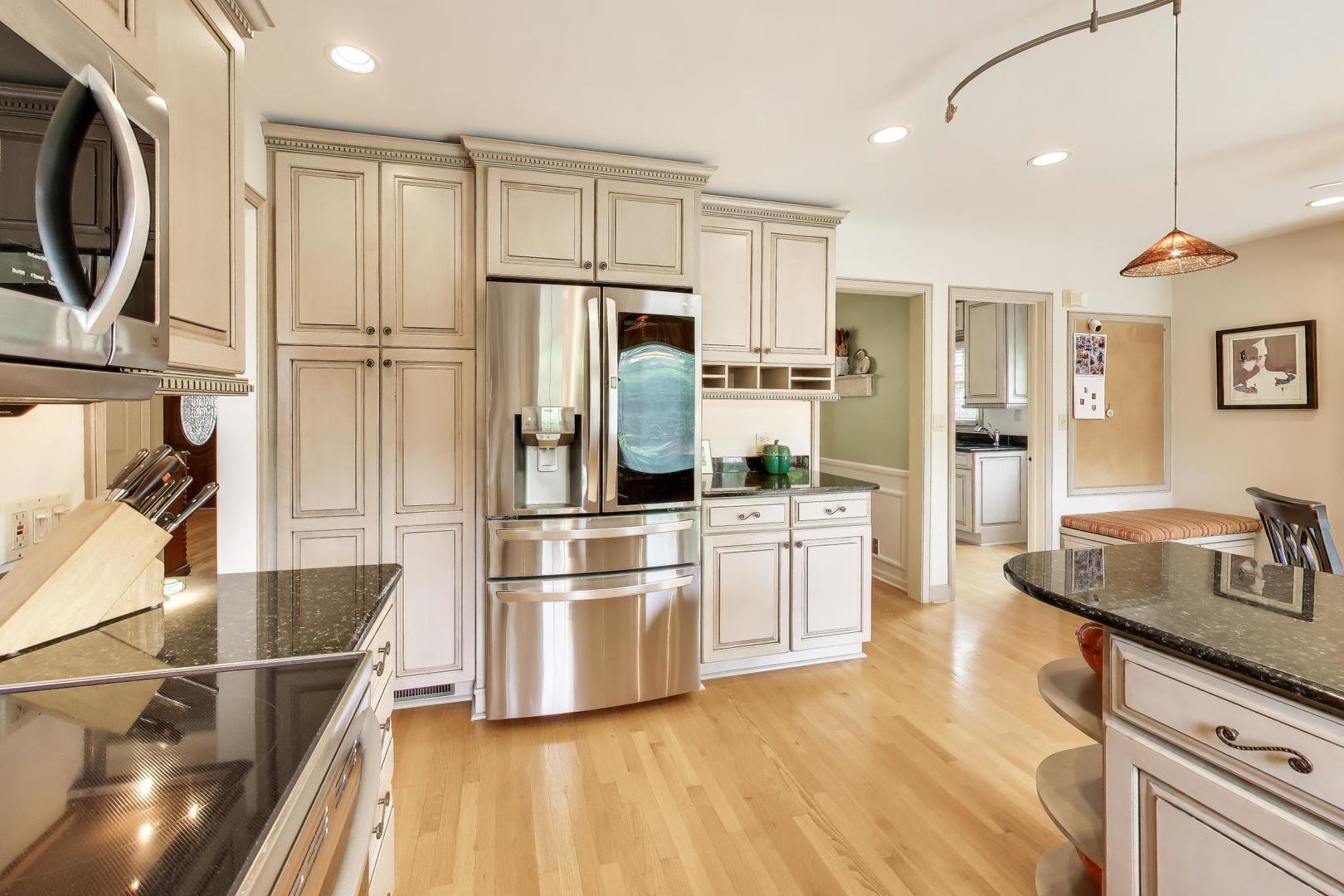 3956 Rutgers Lane Northbrook, IL 60062 - Photo 10 of 41 a kitchen with stainless steel appliances a refrigerator stove microwave and sink