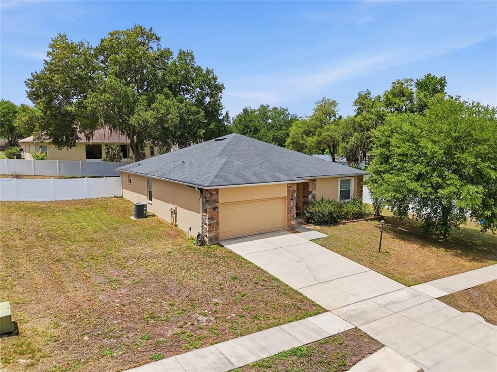 306 Stone Point Lane Lady Lake, FL 32159 - Photo 2 of 39 a view of a house with a yard