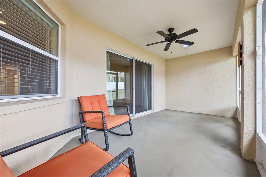 306 Stone Point Lane Lady Lake, FL 32159 - Photo 30 of 39 a view of a livingroom with furniture and a ceiling fan