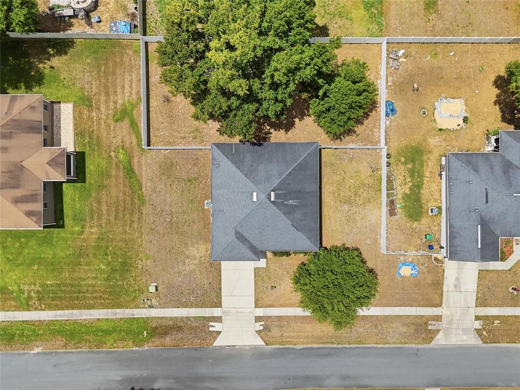306 Stone Point Lane Lady Lake, FL 32159 - Photo 3 of 39 an aerial view of a house with a yard