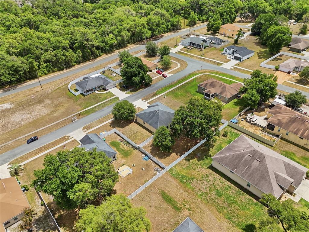 306 Stone Point Lane Lady Lake, FL 32159 - Photo 4 of 39 an aerial view of a house with a garden