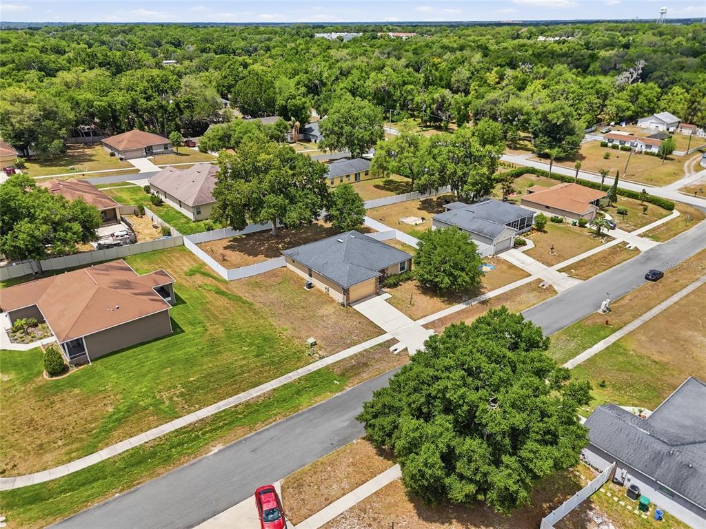 306 Stone Point Lane Lady Lake, FL 32159 - Photo 6 of 39 an aerial view of residential houses with yard