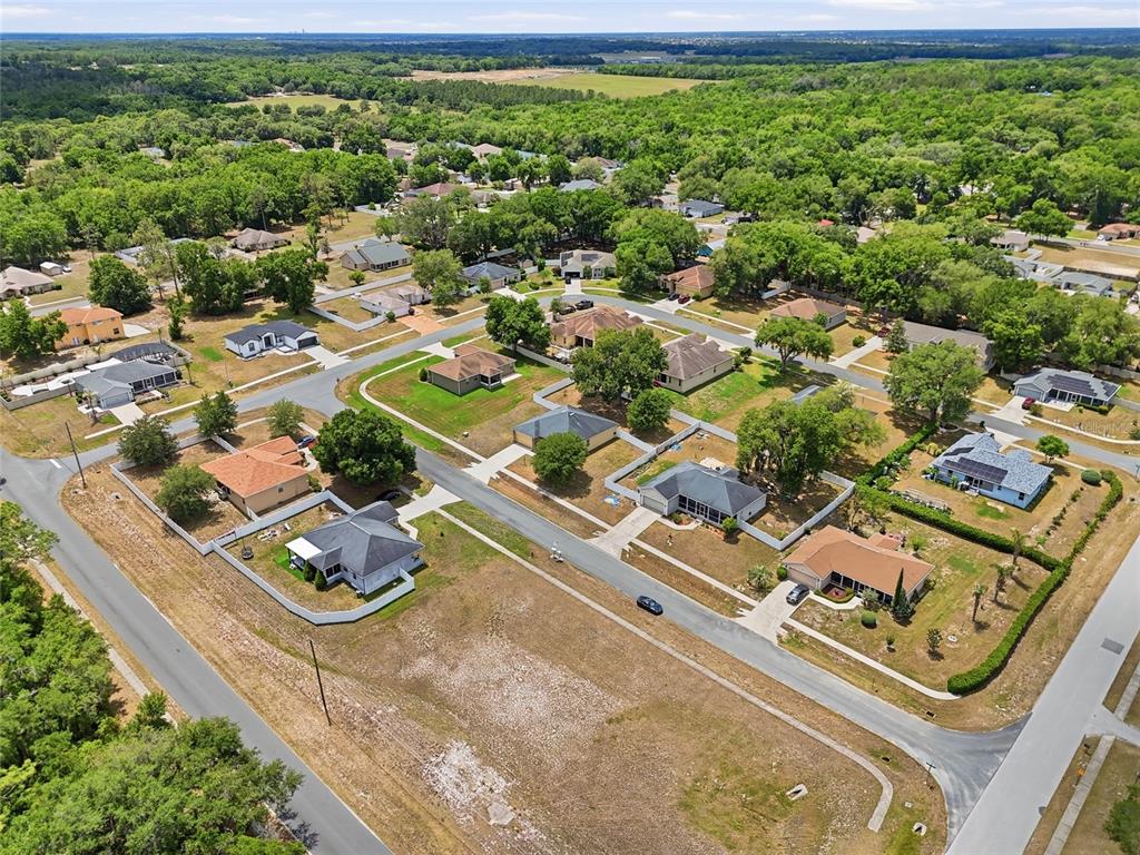306 Stone Point Lane Lady Lake, FL 32159 - Photo 8 of 39 an aerial view of residential houses with outdoor space