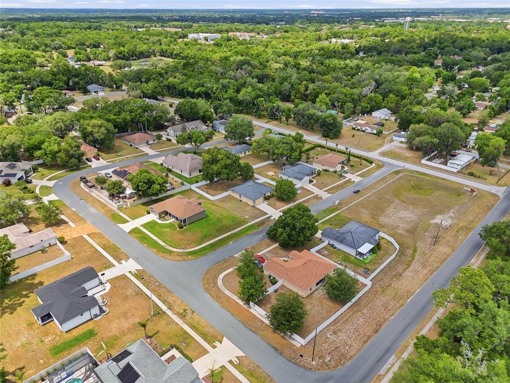 306 Stone Point Lane Lady Lake, FL 32159 - Photo 9 of 39 an aerial view of residential houses with outdoor space
