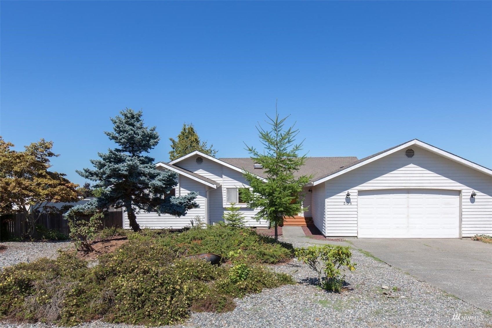 308 Eunice Street Sequim, WA 98382 - Photo 1 of 38 a front view of a house with garden