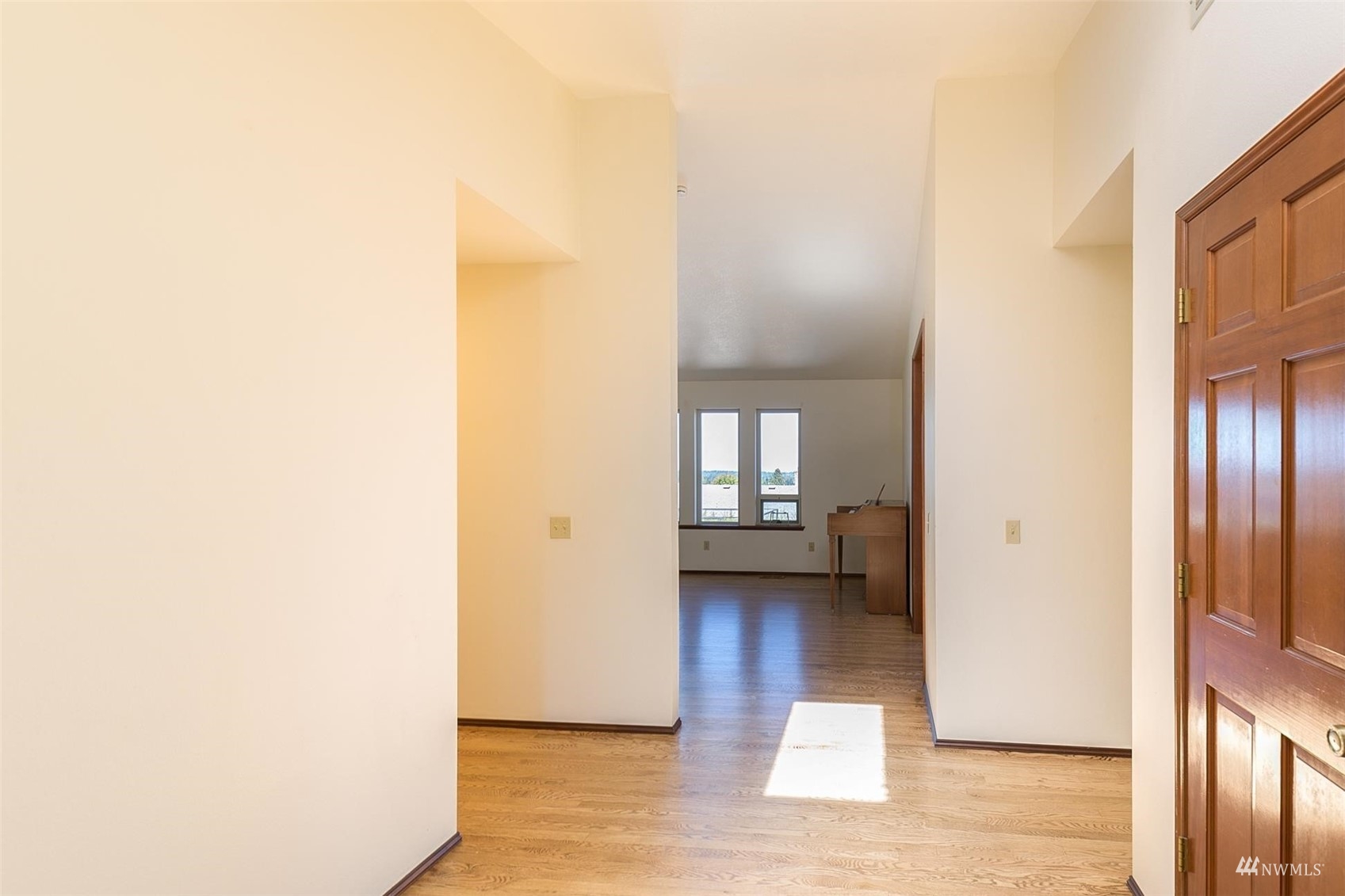 308 Eunice Street Sequim, WA 98382 - Photo 18 of 38 a view of an empty room with wooden floor and a window