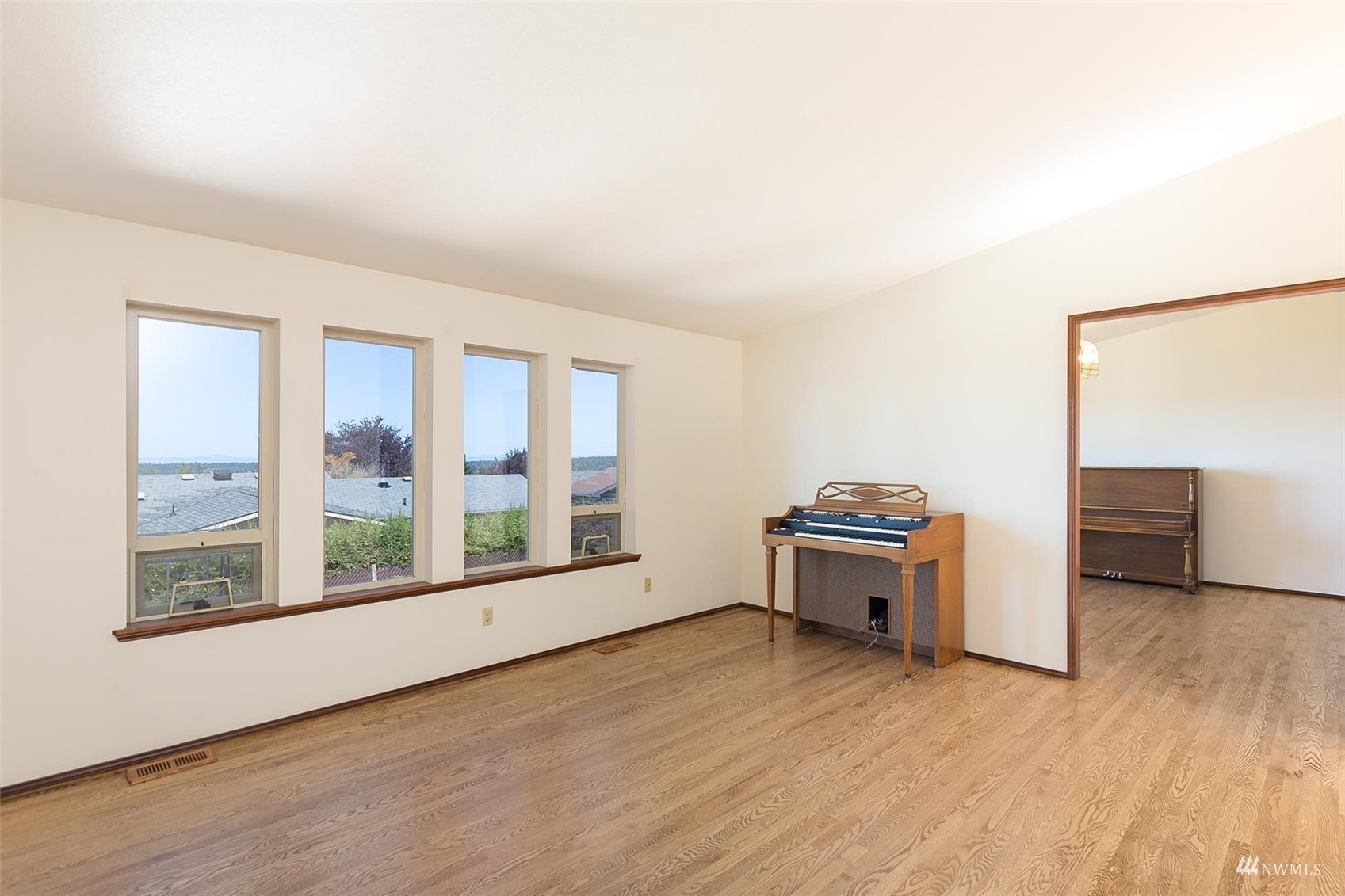 308 Eunice Street Sequim, WA 98382 - Photo 19 of 38 wooden floor in an empty room with a window