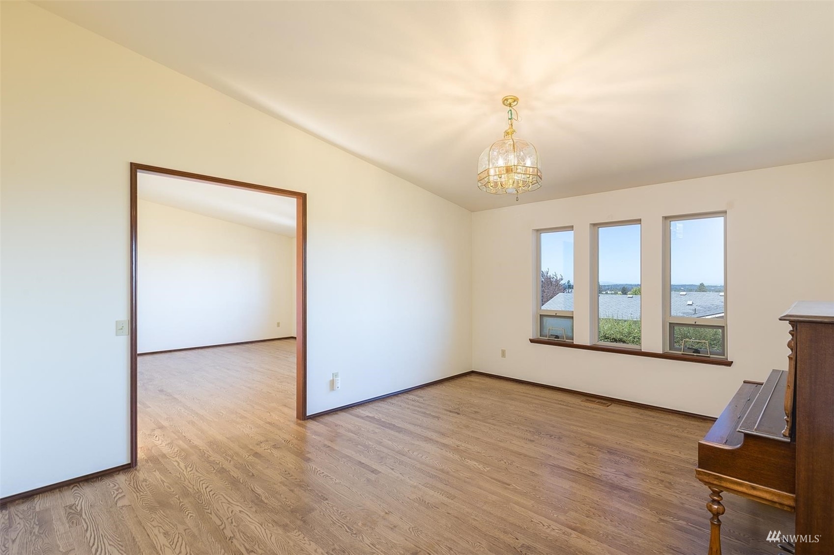 308 Eunice Street Sequim, WA 98382 - Photo 22 of 38 wooden floor in an empty room with a window