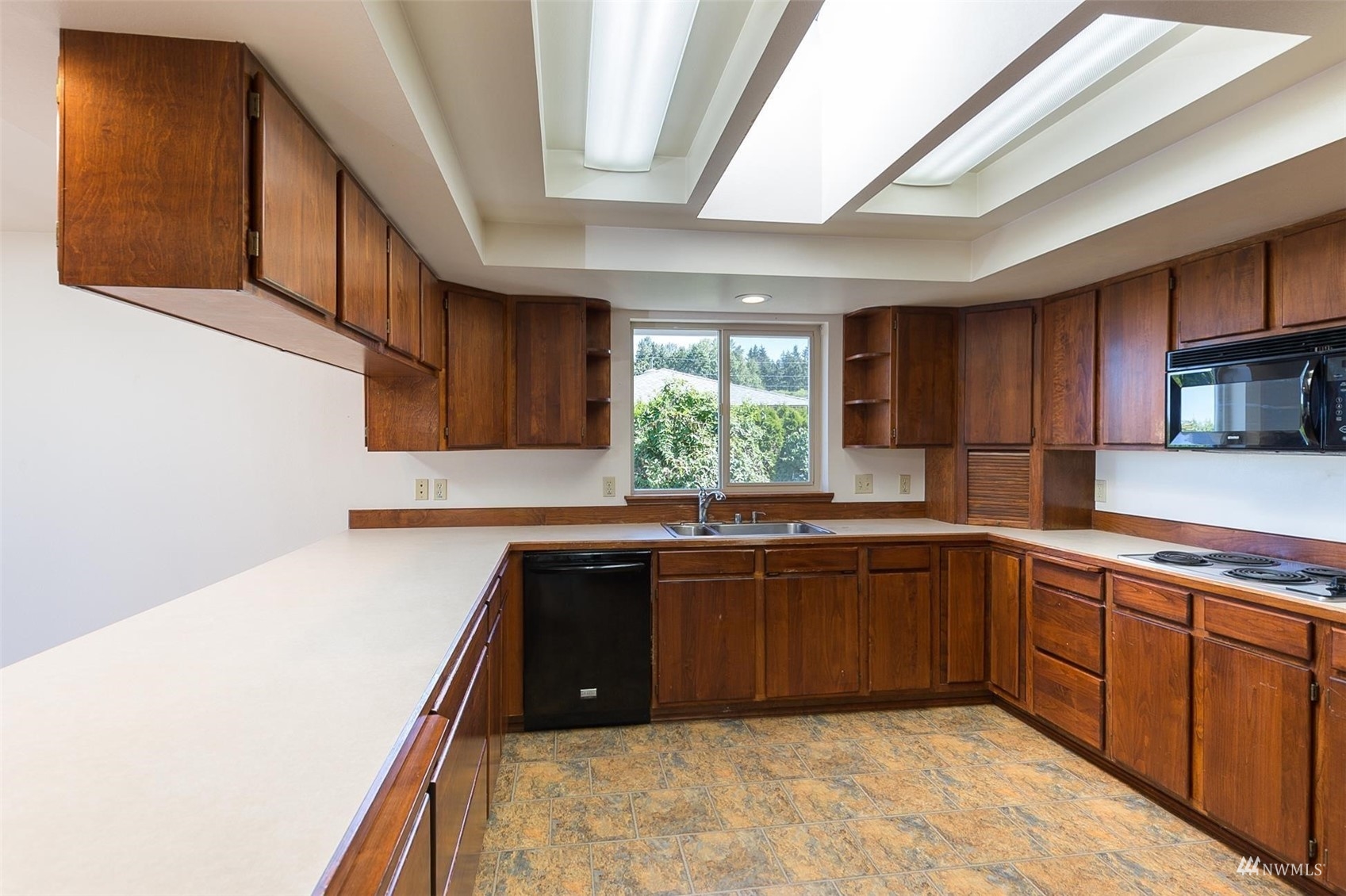 308 Eunice Street Sequim, WA 98382 - Photo 24 of 38 a kitchen with sink and cabinets
