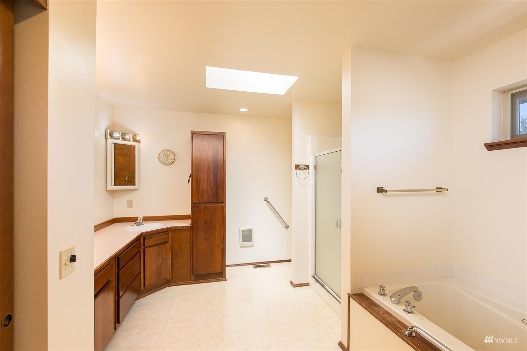 308 Eunice Street Sequim, WA 98382 - Photo 29 of 38 a bathroom with a bathtub sink and mirror