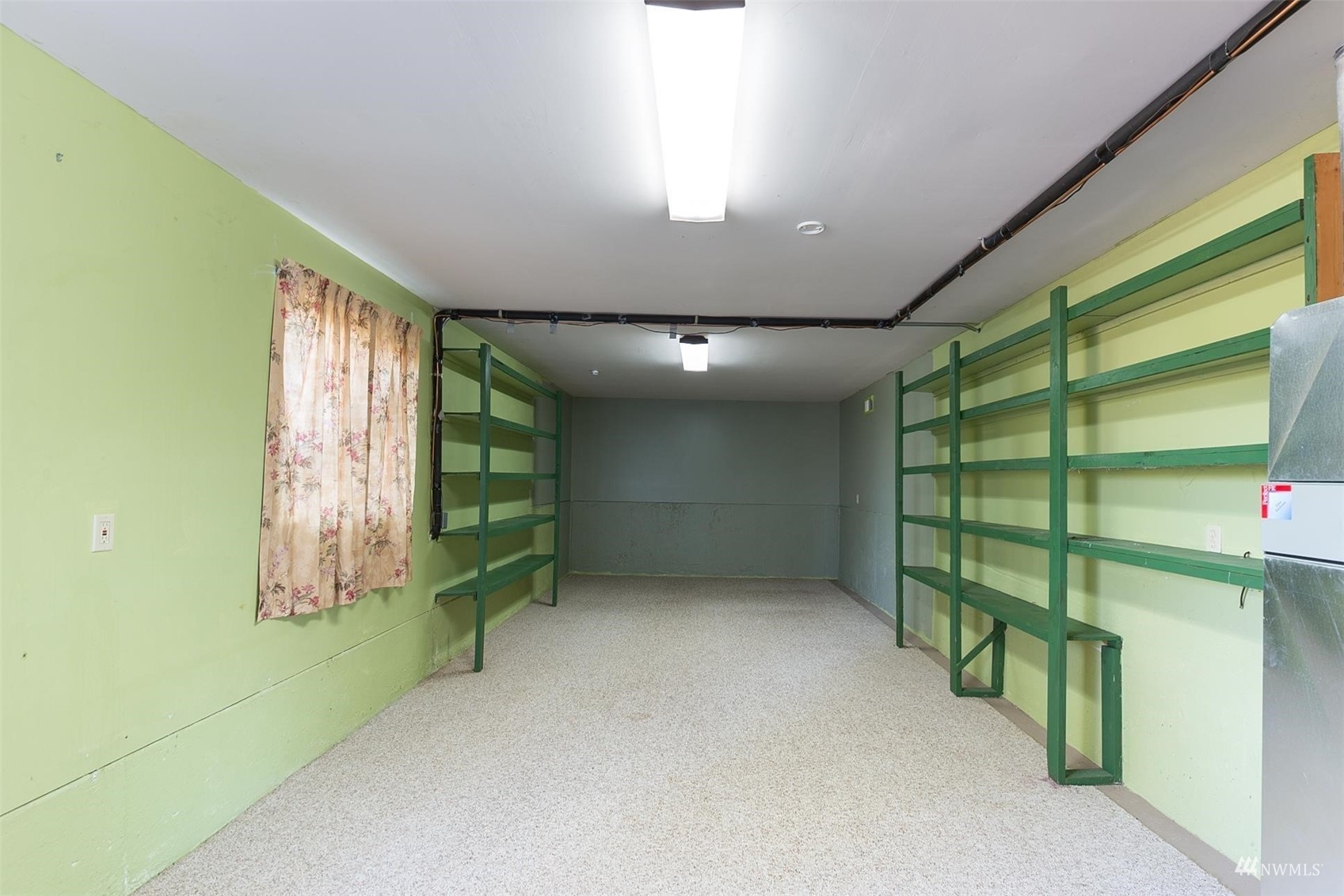 308 Eunice Street Sequim, WA 98382 - Photo 37 of 38 a view of an empty room with stairs and a window