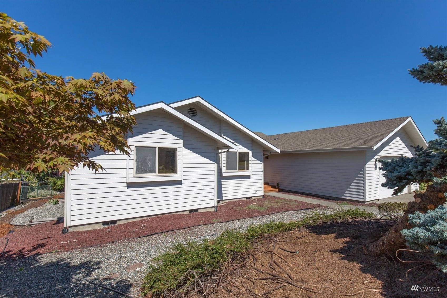 308 Eunice Street Sequim, WA 98382 - Photo 4 of 38 a front view of a house with a yard