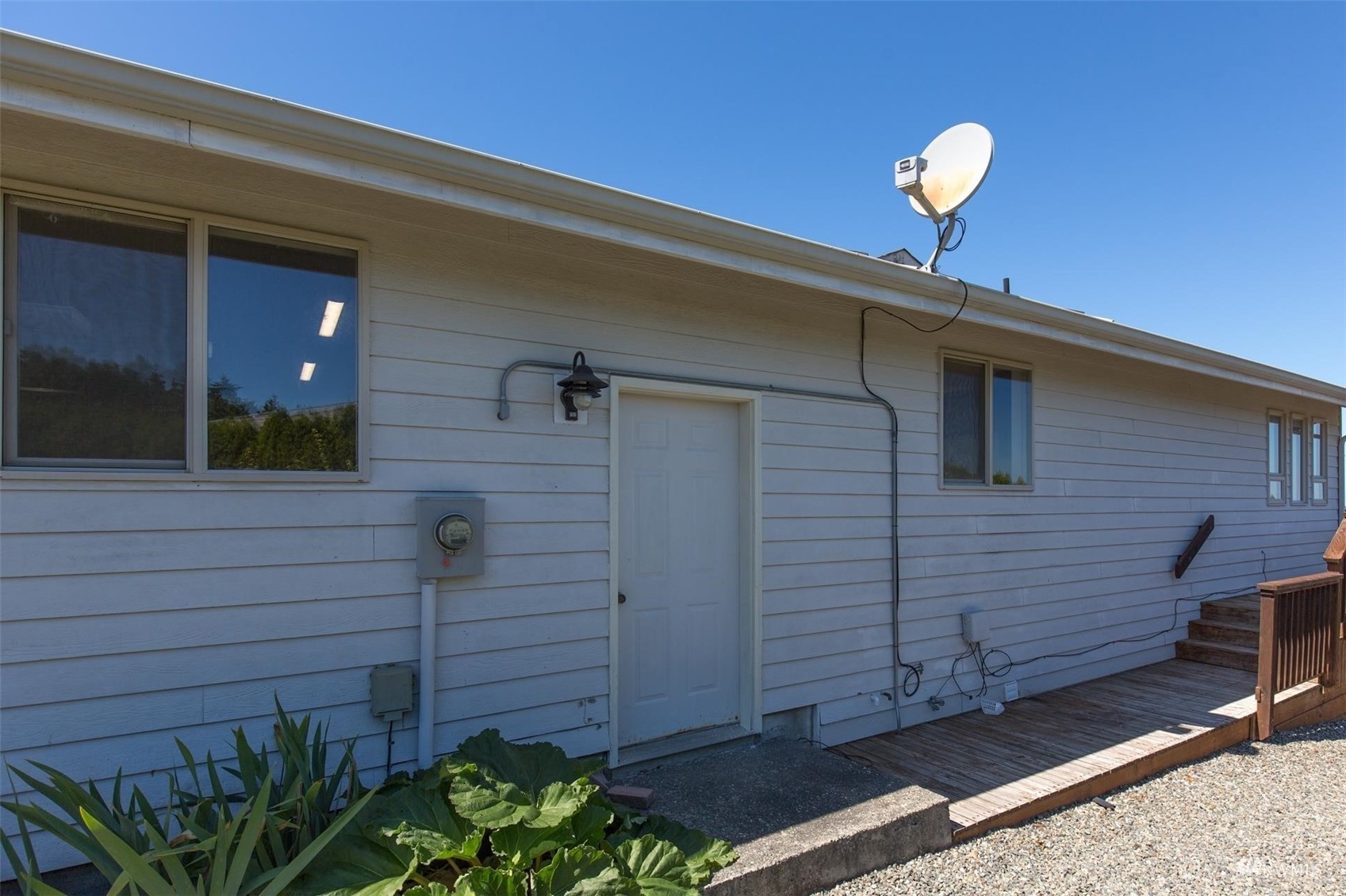 308 Eunice Street Sequim, WA 98382 - Photo 7 of 38 a front view of a house with a plants