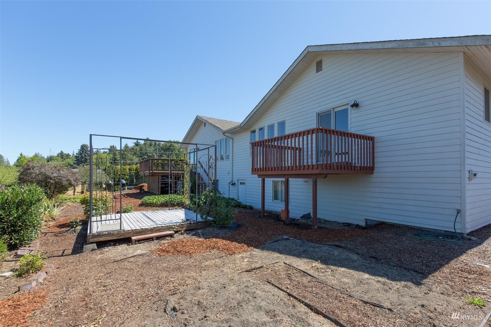 308 Eunice Street Sequim, WA 98382 - Photo 9 of 38 a view of a chair and tables in patio