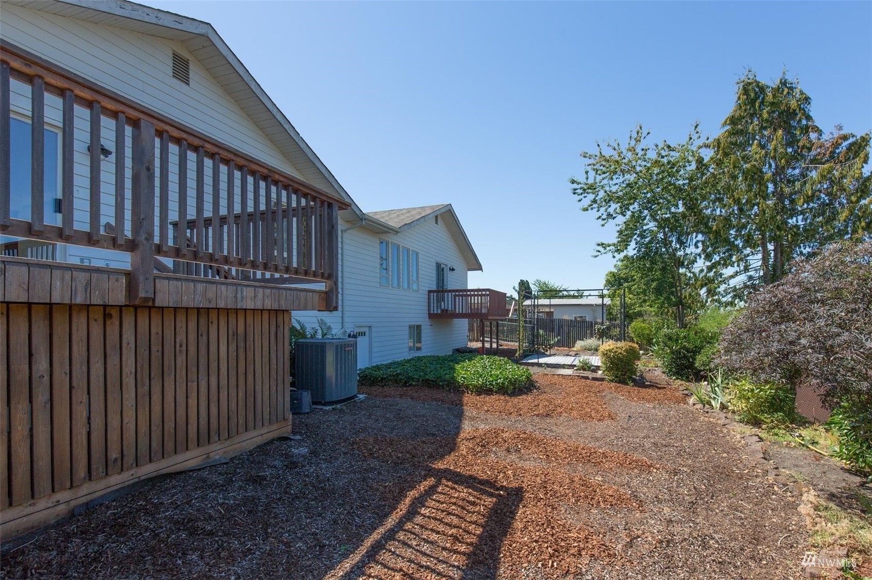 308 Eunice Street Sequim, WA 98382 - Photo 10 of 38 a view of a house with a yard