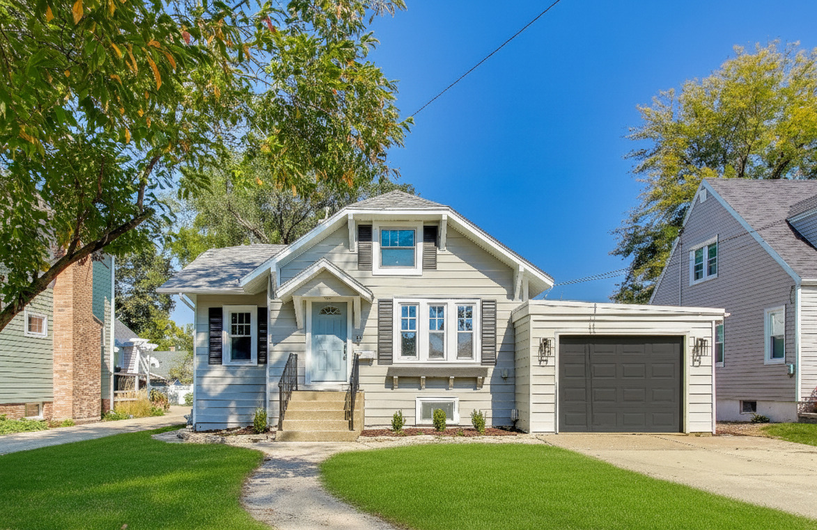 front view of a house with a yard