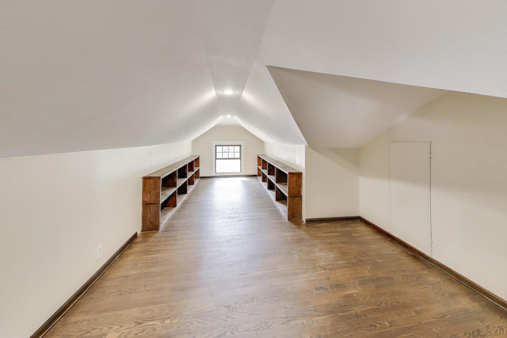 421 East Indiana Street Wheaton, IL 60187 - Photo 15 of 37 a hallway with wooden floor and chandelier