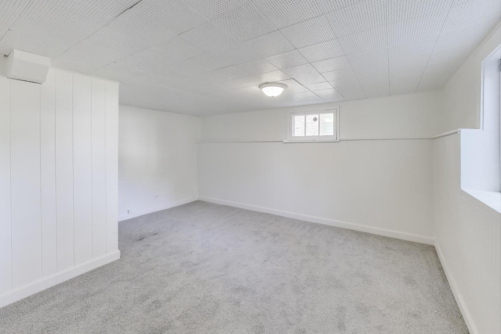 421 East Indiana Street Wheaton, IL 60187 - Photo 18 of 37 an empty room with windows