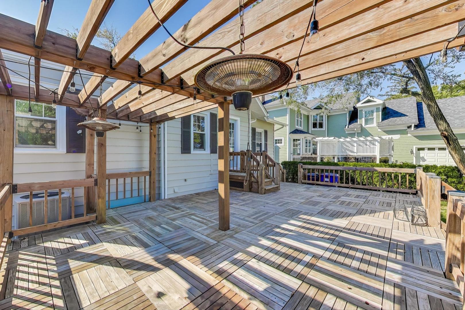 421 East Indiana Street Wheaton, IL 60187 - Photo 24 of 37 a view of a patio with a table and chairs