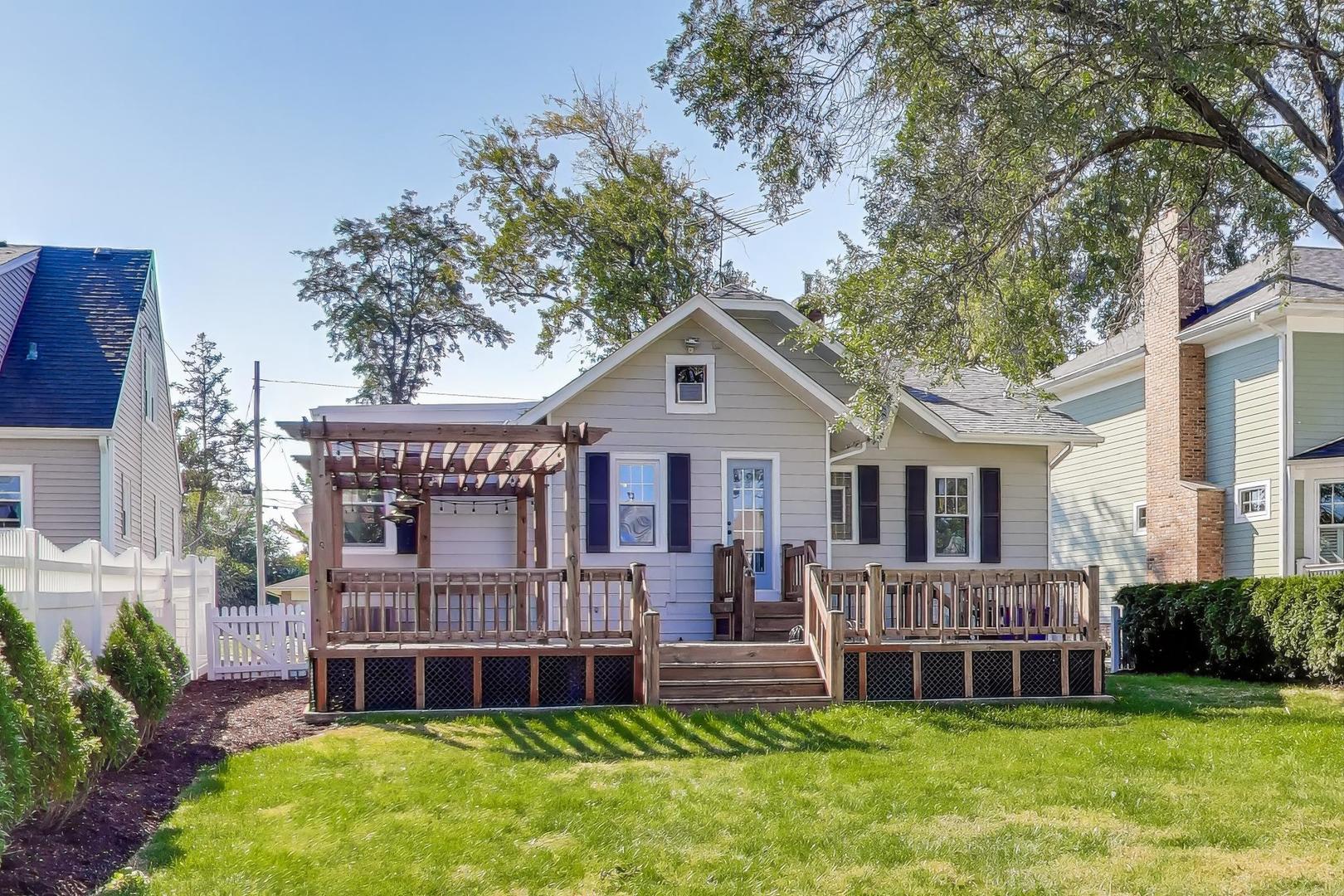 421 East Indiana Street Wheaton, IL 60187 - Photo 25 of 37 a view of a house with a big yard and large trees