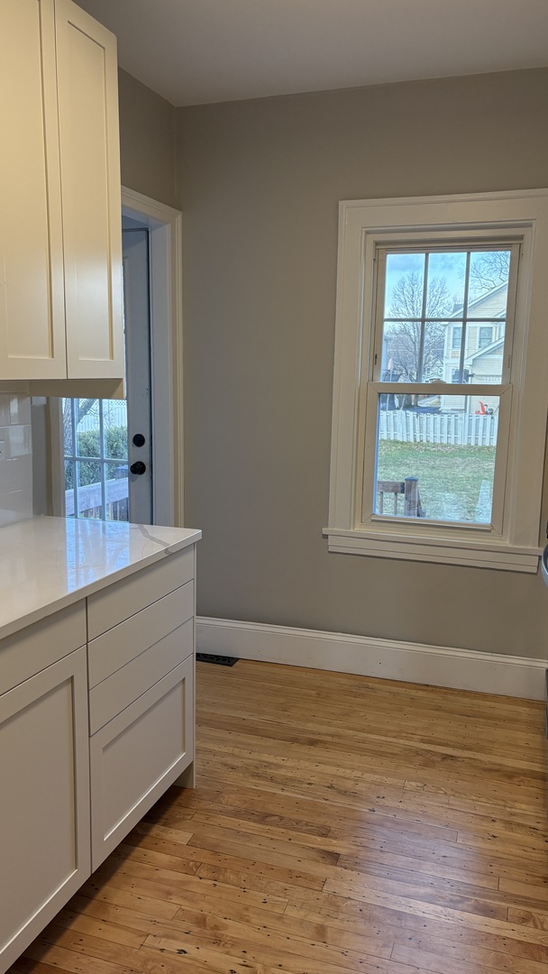 421 East Indiana Street Wheaton, IL 60187 - Photo 35 of 37 a room with hard wood floors and a window